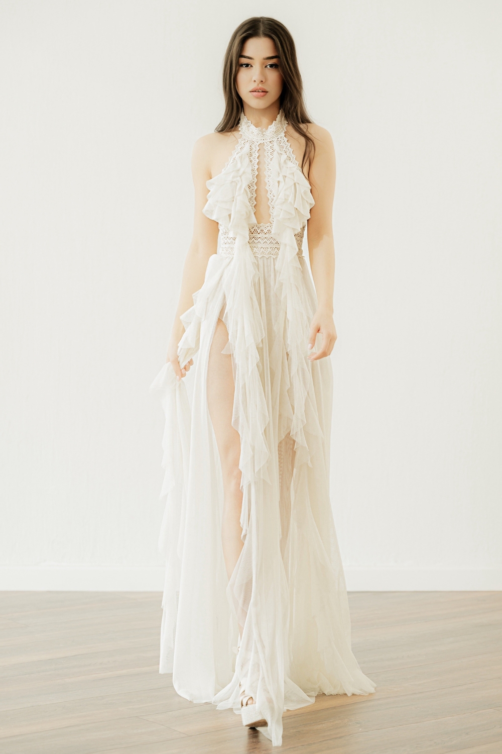 Boho high slit wedding dress with vintage lace bodice, ruffle front detailing, halter neckline and optional detachable sleeves – 'Jade' by Atelier Zolotas.