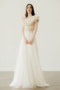 Model in 'Maraya', a handcrafted crop top fringe wedding dress by Atelier Zolotas