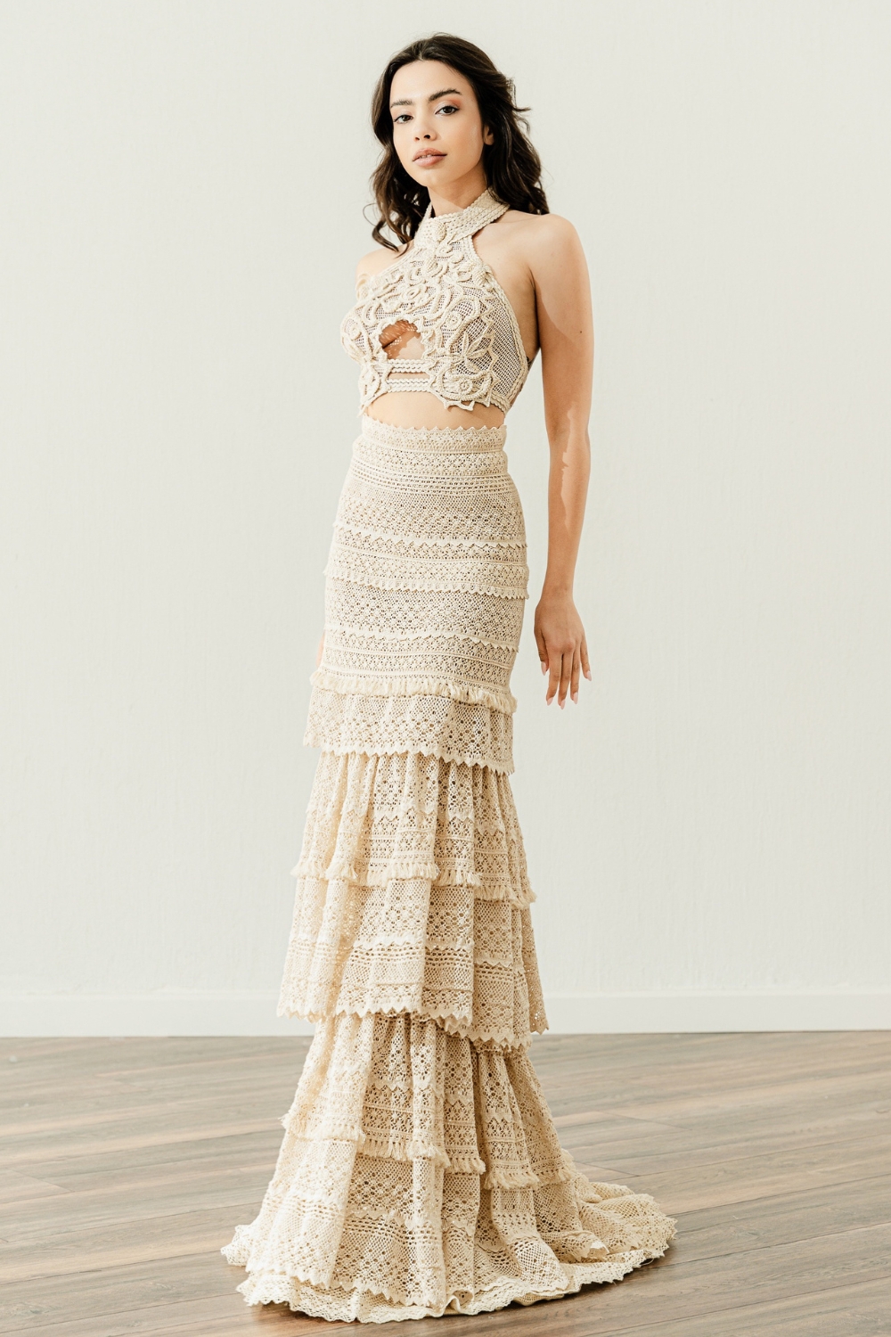 Brunette model in the crochet crop top wedding dress 'Salomi' paired with a mermaid skirt by Atelier Zolotas